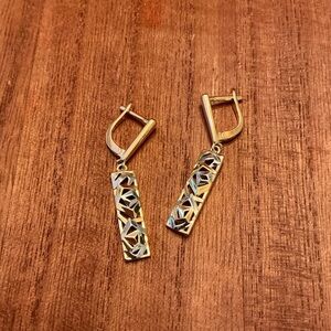 Geometric hollow pendant earrings, golden silvery color, made of copper.